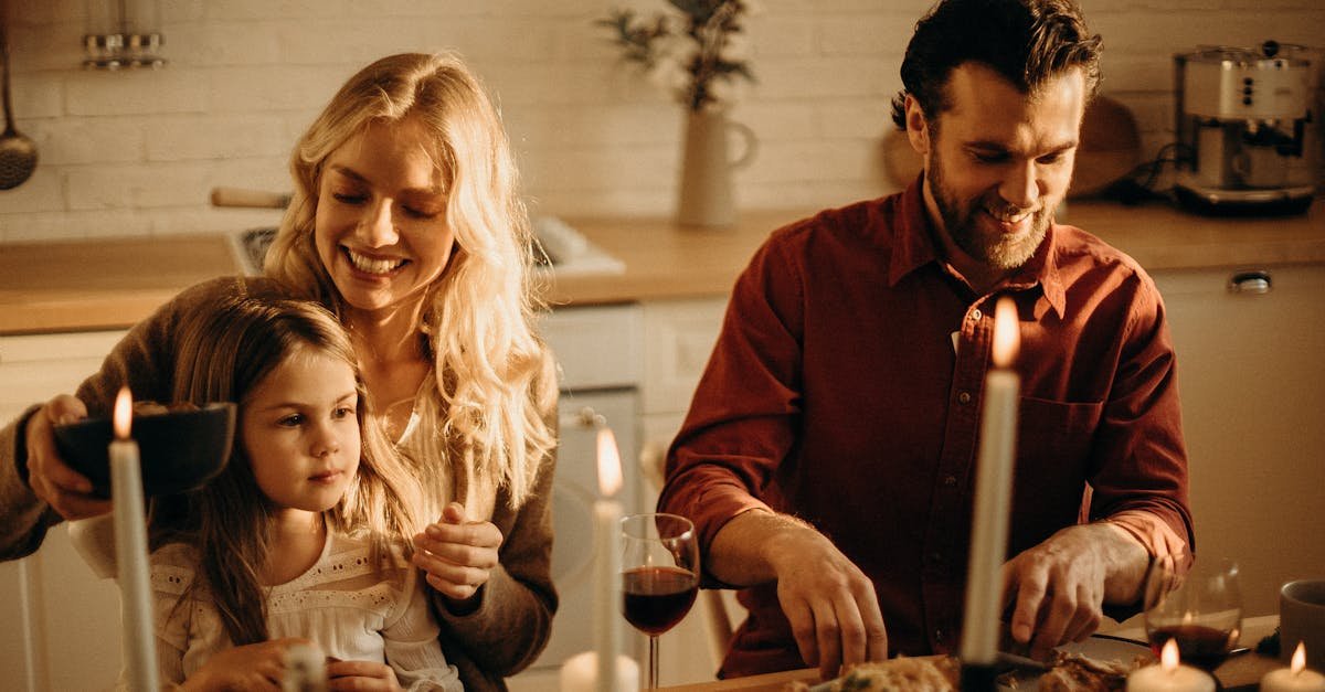 Family enjoying a cozy holiday dinner together, sharing love and joy indoors.