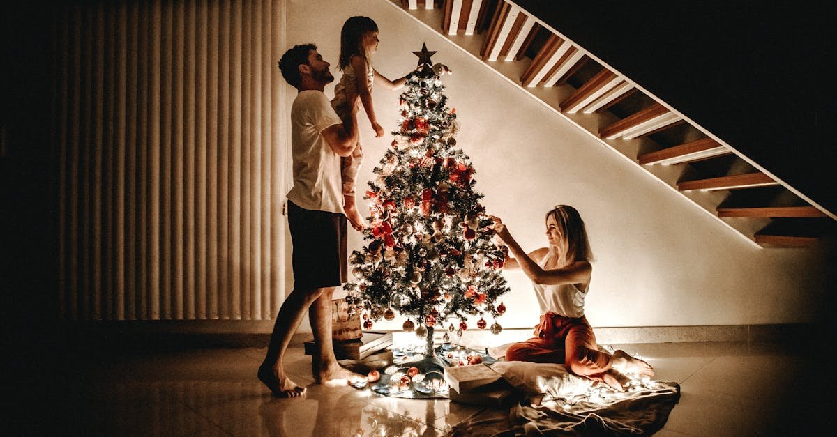 A family decorates a Christmas tree, bringing warmth and joy to the holiday season.