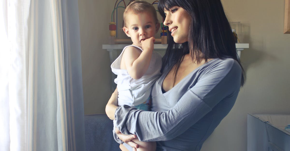 A loving moment between a mother and her child in an indoor setting, fostering connection and warmth.